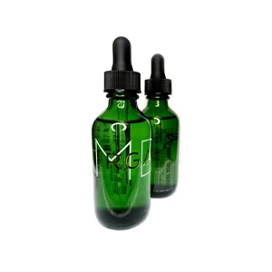 Two green glass dropper bottles with black lids