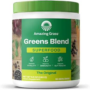 Container of powdered greens supplement labeled "Greens Blend Superfood."
